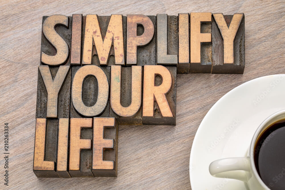 Embrace Minimalism: A Journey from $20,000 Debt to Financial Freedom 5 simplify your life - word asbtract in wood type